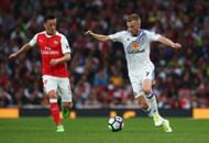 LONDON, ENGLAND - MAY 16: Mesut Ozil of Arsenal puts pressure on Sebastian Larsson of Sunderland during the Premier League match between Arsenal and Sunderland at Emirates Stadium on May 16, 2017 in London, England.  (Photo by Charlie Crowhurst/Getty Images)